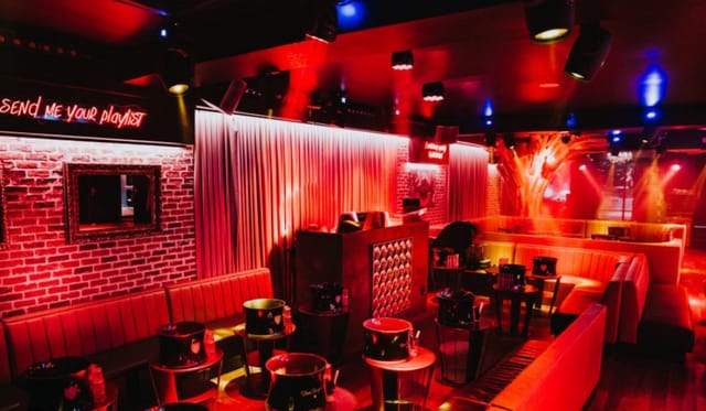 Cova Backdoor VIP lounge with red lighting, ideal for intimate events and private parties.