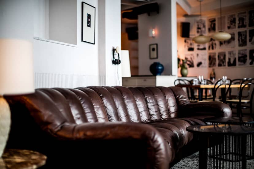 Le Pigalle bar with leather seating for high-end networking and corporate events.