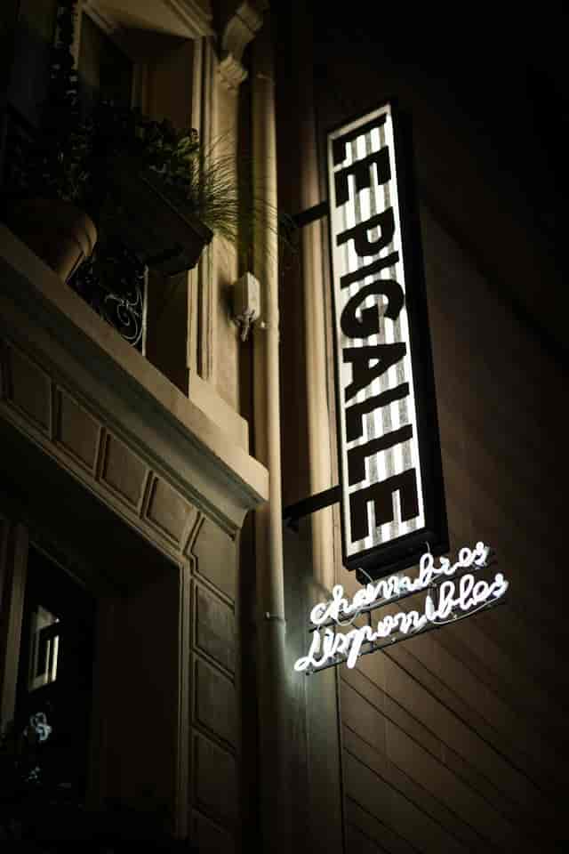 Le Pigalle lounge storefront sign, moody boutique venue for urban evening events.