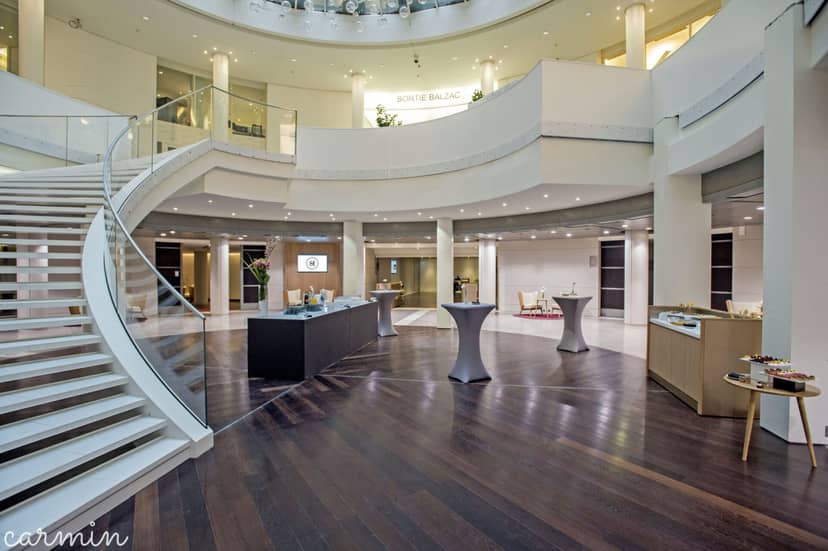 Etoile Saint-Honoré conference foyer with grand staircase for corporate events and galas.