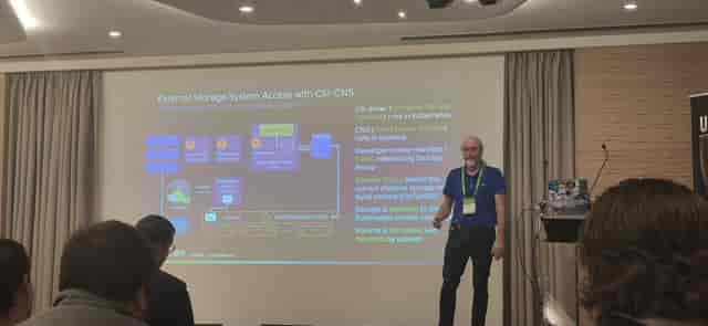 Speaker presenting at Etoile Saint-Honoré conference breakout session with professional AV setup.