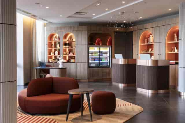 Luxury AC Hotel Paris reception area for VIP board meetings and corporate event check-ins.