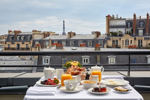 Luxury rooftop terrace breakfast at Hôtel Ampère, Paris venue for VIP executive retreats.