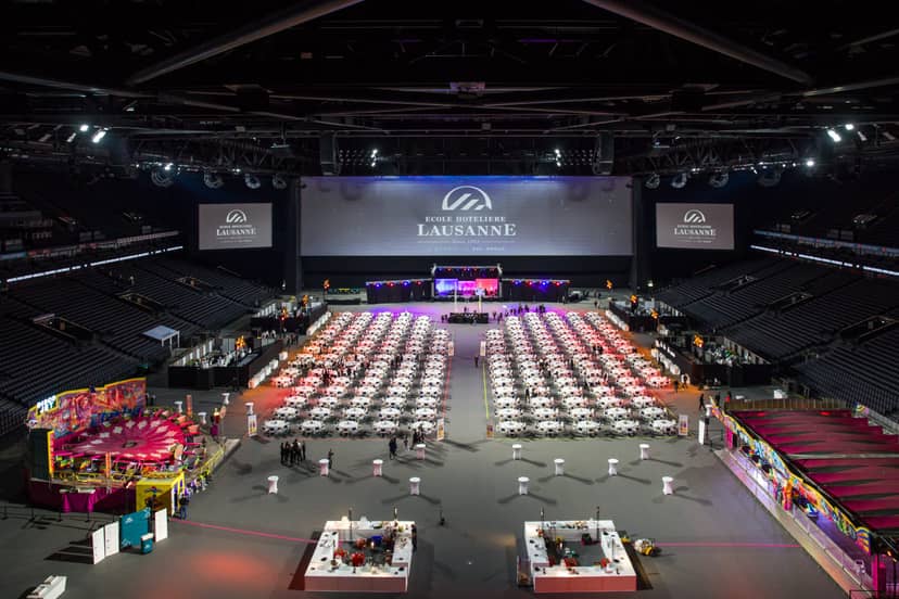 Gala setup at Salon Scutum Paris La Défense Arena with banquet seating and AV branding for events.
