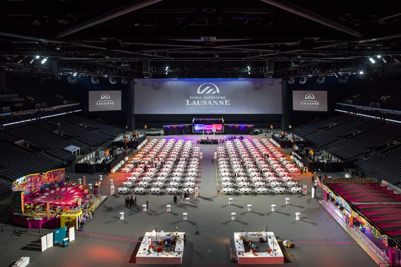 Gala setup at Salon Scutum Paris La Défense Arena with banquet seating and AV branding for events.