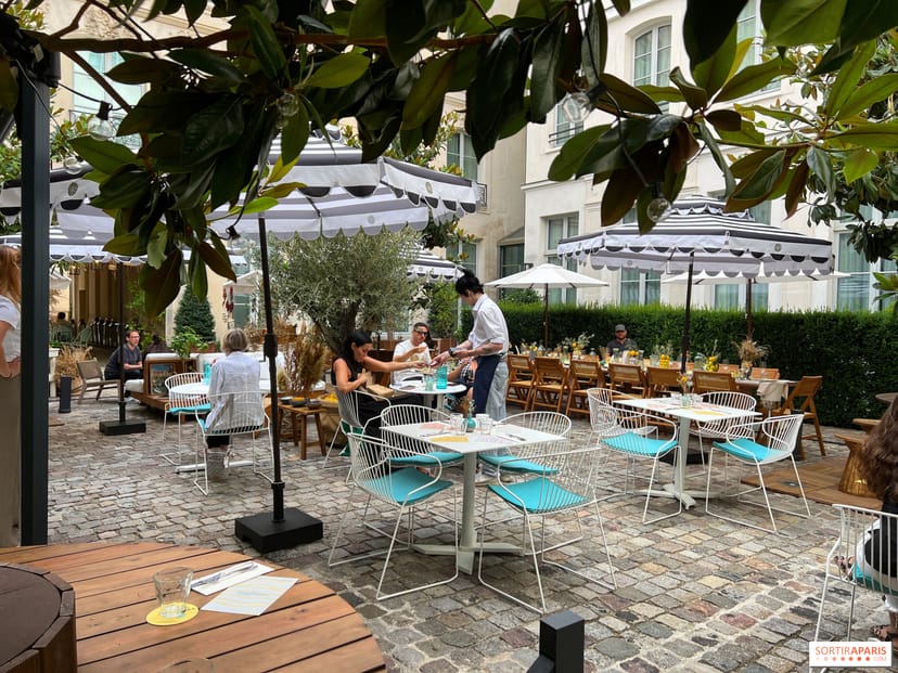 Main Terrace at The Hoxton, Paris: lush courtyard setting for corporate events and networking.