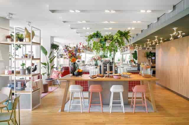 Zoku Paris conference breakout space with communal table for corporate networking and events.