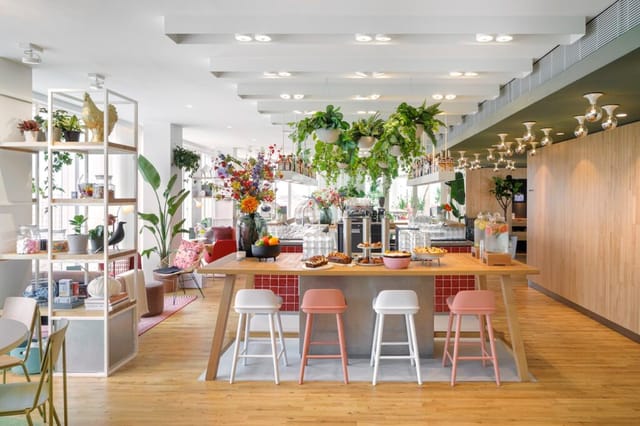 Zoku Paris conference breakout space with communal table for corporate networking and events.