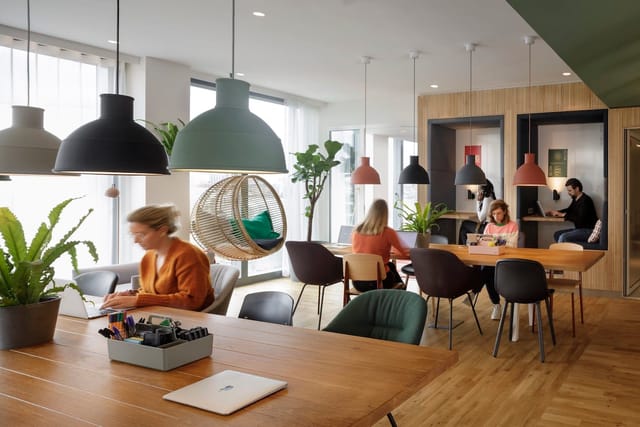 Modern Zoku Paris conference center with biophilic design for hybrid workspace and event meetings.