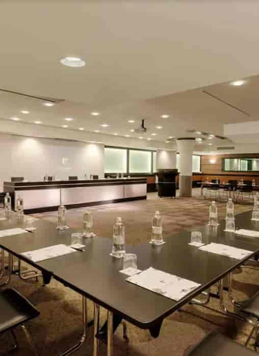 U-shaped Carmagnola Room meeting space with AV tech for board meetings and corporate training.
