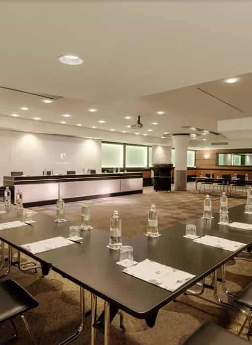 U-shaped Carmagnola Room meeting space with AV tech for board meetings and corporate training.