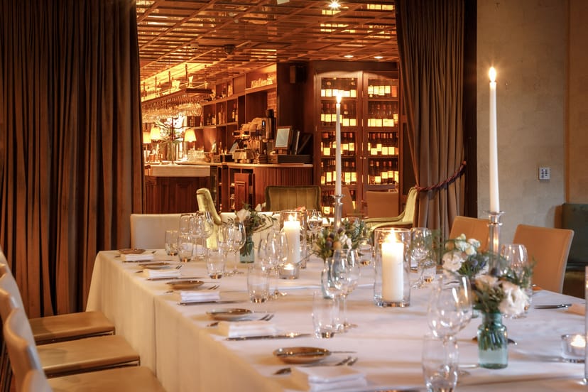 Suesey Suite private dining with warm ambient lighting for corporate dinners and event bookings.