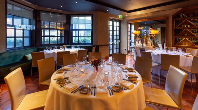 Suesey Street private dining room with round tables for corporate events and formal banquets.