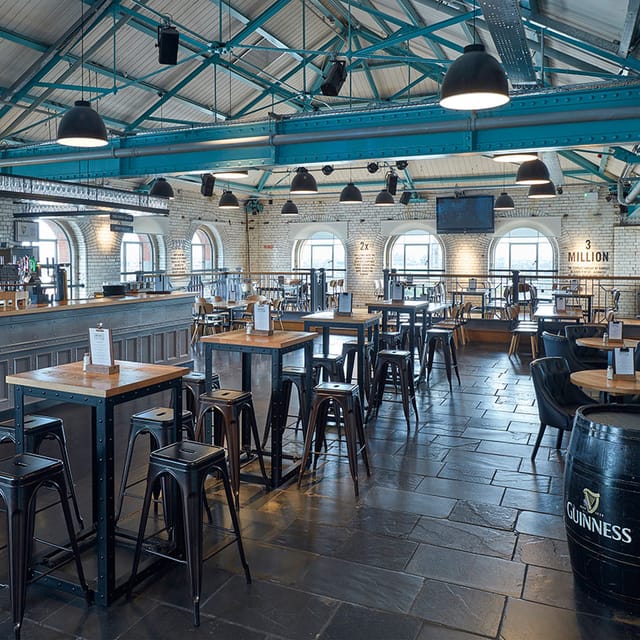 Spacious Arthurs Bar at Guinness Storehouse, ideal for events and gatherings.