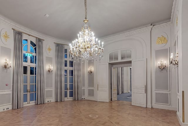 Elegant Loggia Suite event space with chandeliers, ideal for corporate meetings and upscale receptions.
