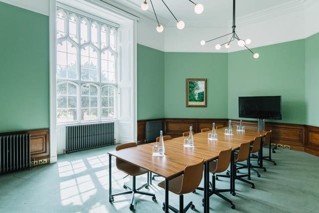 Bonar Law meeting room at Ashridge House, featuring a long wooden table and modern lighting.