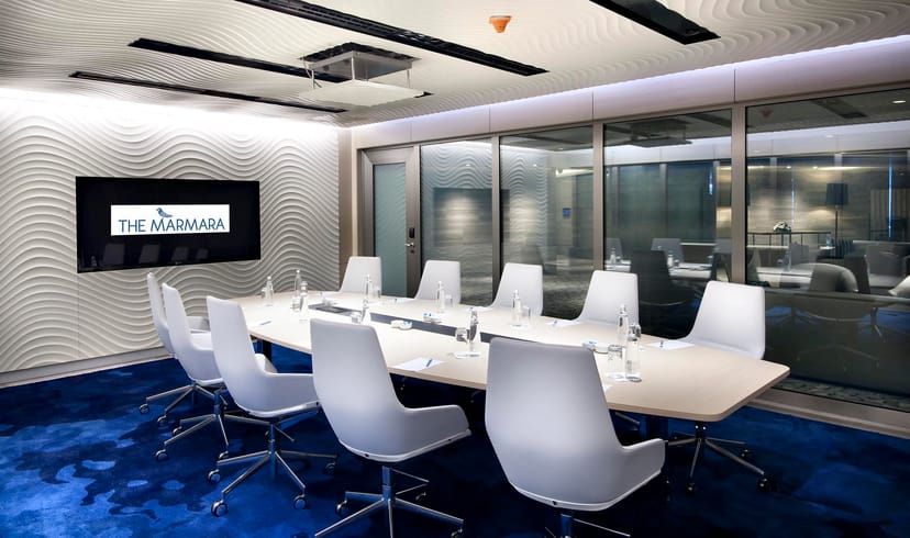 Modern boardroom at The Marmara Taksim Hotel for executive meetings and corporate strategy sessions.