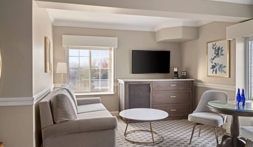 Meeting room at The Madison Hotel with natural light for informal gatherings.