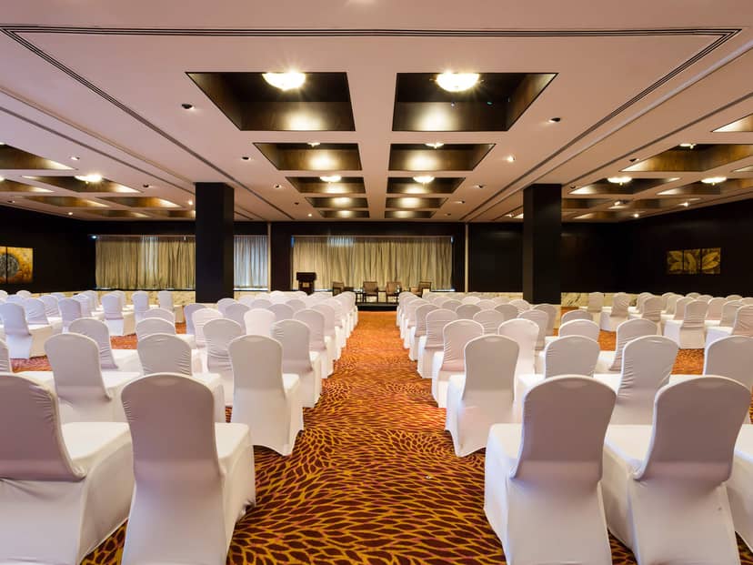 Hyatt Regency Dar es Salaam theater-style hotel ballroom with stage, ideal for conference events.