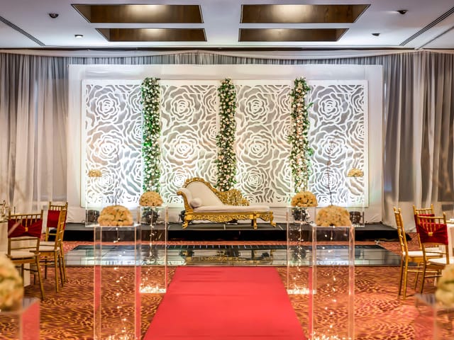 Wedding ceremony backdrop at Kibo Ballroom, Hyatt Regency Dar es Salaam with floral decor.