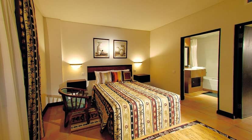 Blue Pearl Hotel suite with en-suite bathroom for corporate event housing and business travel.