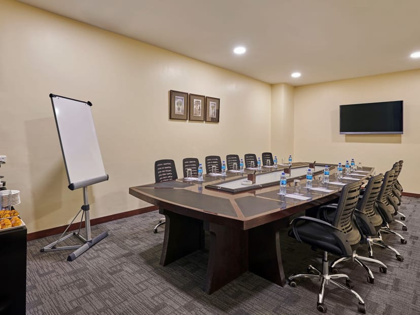 Mayfair Hotel boardroom with integrated power table for strategy sessions and corporate meetings.