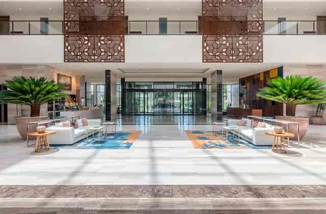 Gran Meliá Arusha hotel lobby: airy, symmetrical space for VIP events and business conferences.