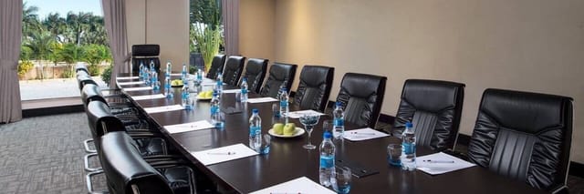 Boardroom conference room setup with fruit arrangements for corporate meetings and event planning.