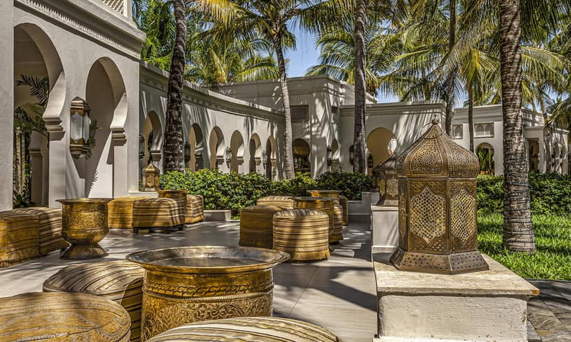 Luxury wedding bower with ornate brass accents for upscale cocktail receptions and event venues.