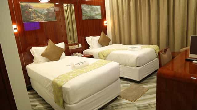 Jaromax Palace Hotel twin room: budget hotel accommodation for business travel and event lodging.