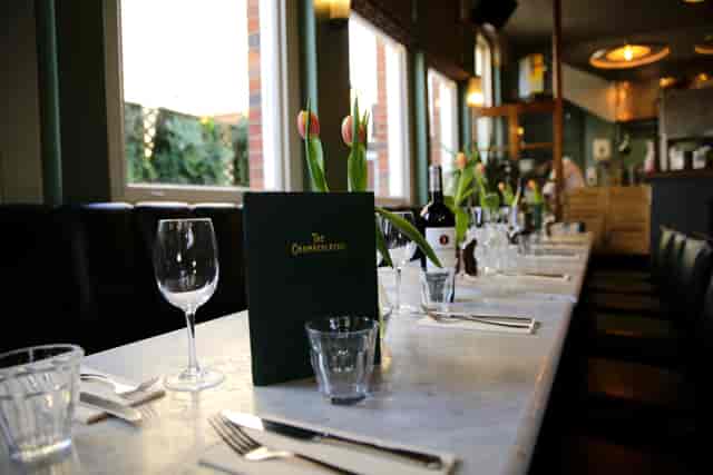 Elegant Dining Room at The Chamberlayne with long table, perfect for corporate dinners and events.