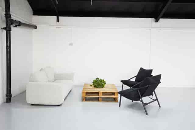 Industrial-chic 2050 sqft warehouse studio for networking and professional photography events.