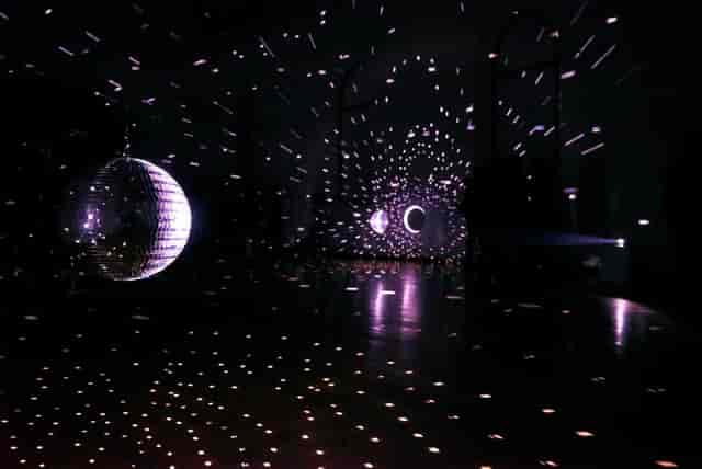 Disco ball lighting at Kapellhaus venue for immersive evening reception and corporate event.