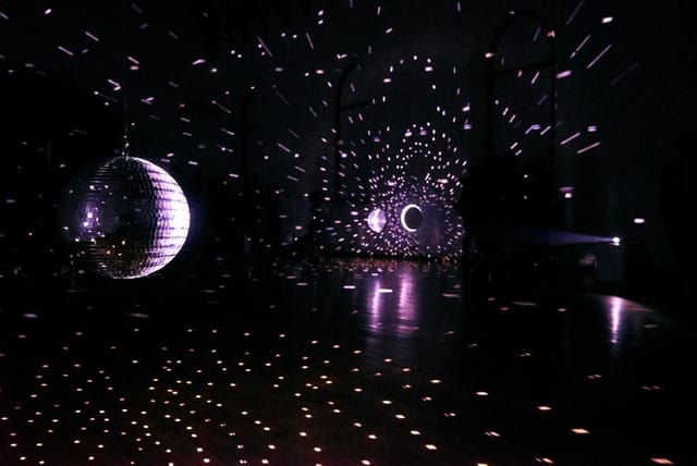 Disco ball lighting at Kapellhaus venue for immersive evening reception and corporate event.