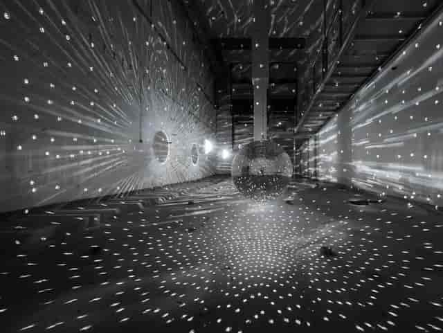 Industrial event space at Kapellhaus with atmospheric lighting for immersive corporate conferences.