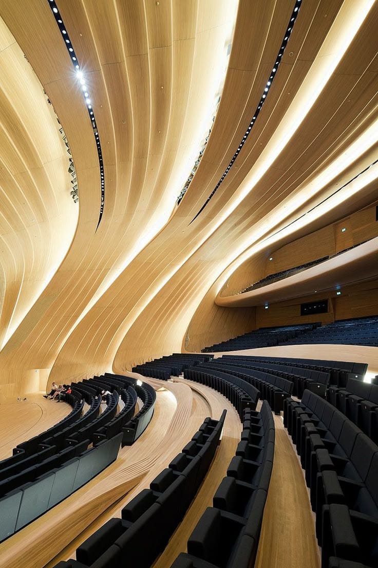 Heydar Aliyev Center auditorium with curved wooden interior for corporate galas and keynote events.