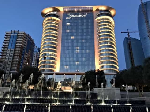 JW Marriott Absheron Baku hotel exterior with fountain for corporate events and luxury summits.