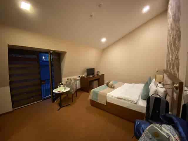 Auroom Hotel conference meeting room with desk and balcony for business events.