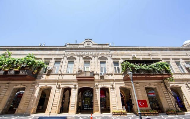 Historic Midway Baku Hotel venue with arched architecture for upscale receptions and events.