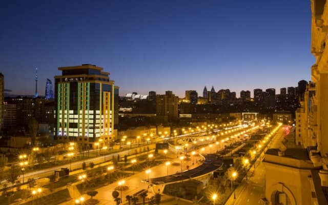 VIP rooftop bar with city skyline view for evening networking and corporate events.