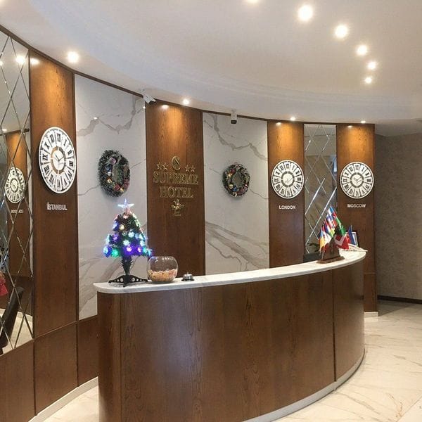Supreme Hotel reception desk for business travel and corporate room-block bookings.