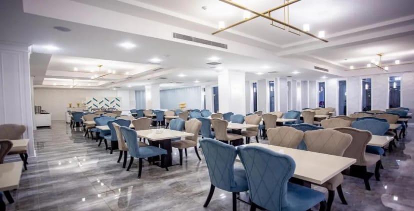 Banquet hall at Alba Hotel with modular tables for corporate events and formal wedding dinners.