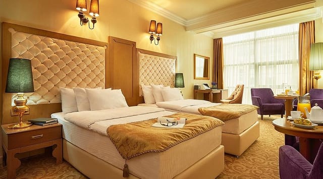 Upscale twin-occupancy hotel suite for conference room blocks and incentive travel.