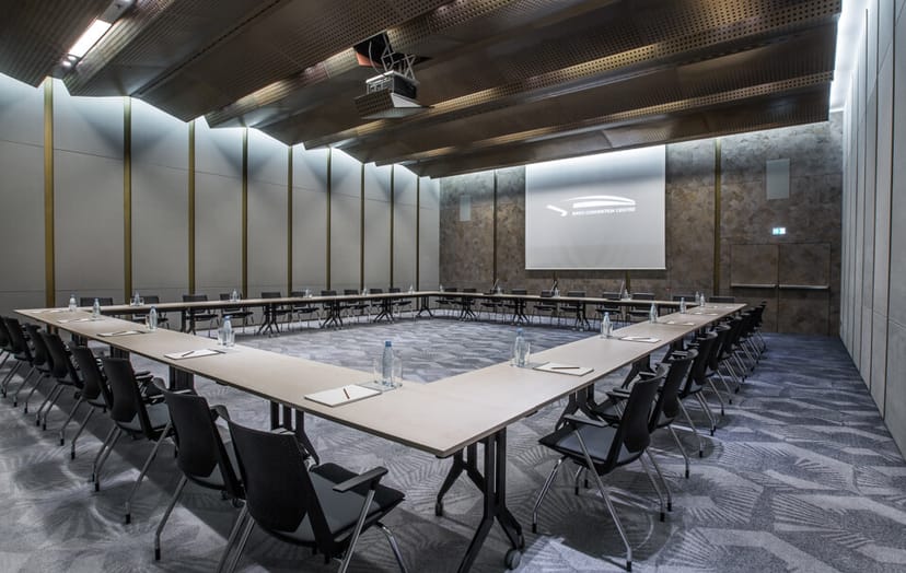 Modern U-shape conference room at Congress Hotel for professional boardroom meetings and workshops.