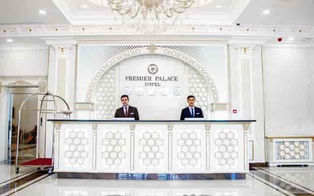 Premier Palace Baku lobby reception desk for VIP arrivals and corporate conference registration.