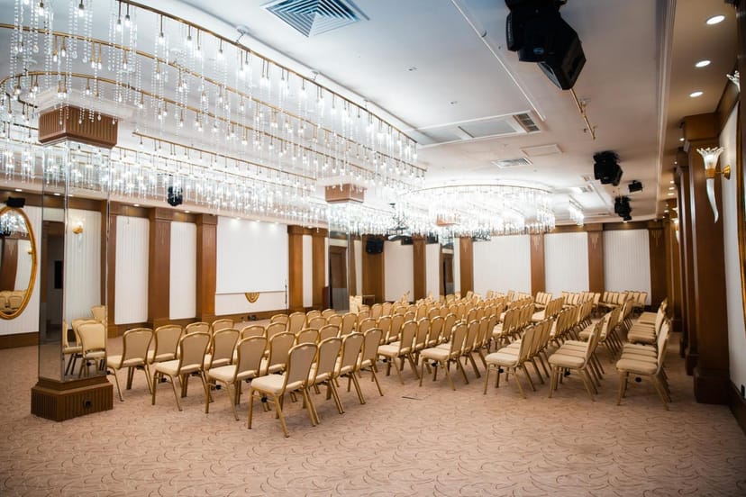 Elegant hotel ballroom in theater setup for corporate events and professional seminars.