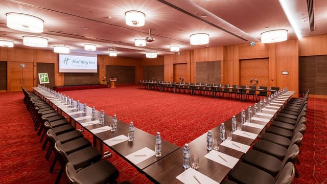 U-shape conference setup in Holiday Inn Baku ballroom for corporate events and business meetings.