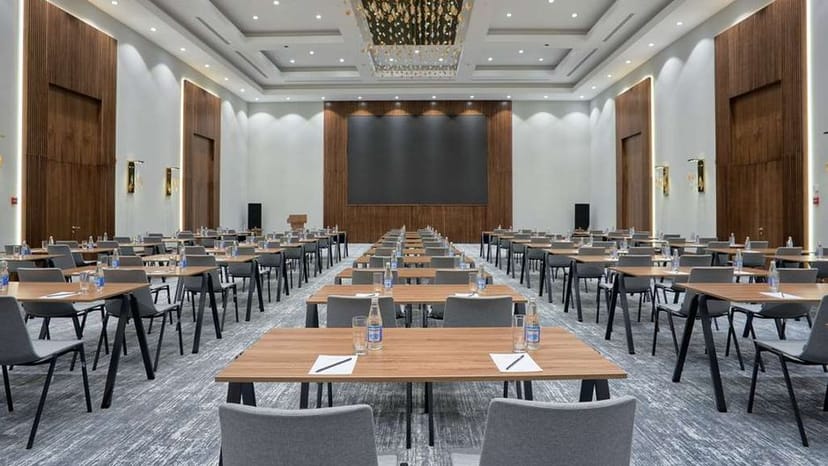 Holiday Inn Baku ballroom with AV screen, ideal for corporate training and professional seminars.