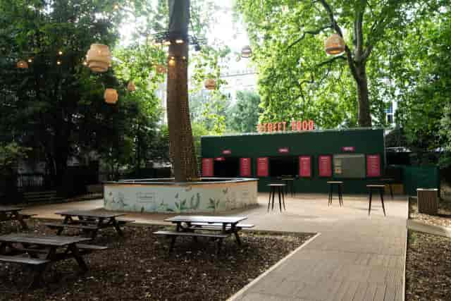 Summer party networking reception with bistro seating in Sunken Garden Bloomsbury.