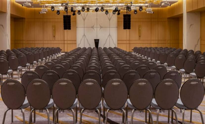 Theater-style Meeting Room 3 with AV rig for corporate presentations and keynote events.